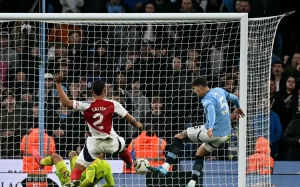 Manchester City defender John Stones scores